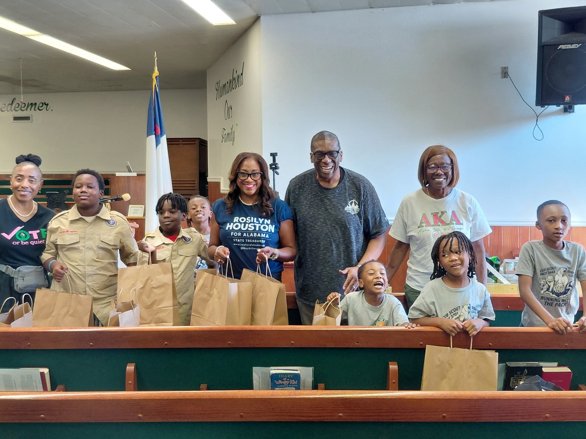 Community group holding donation bags