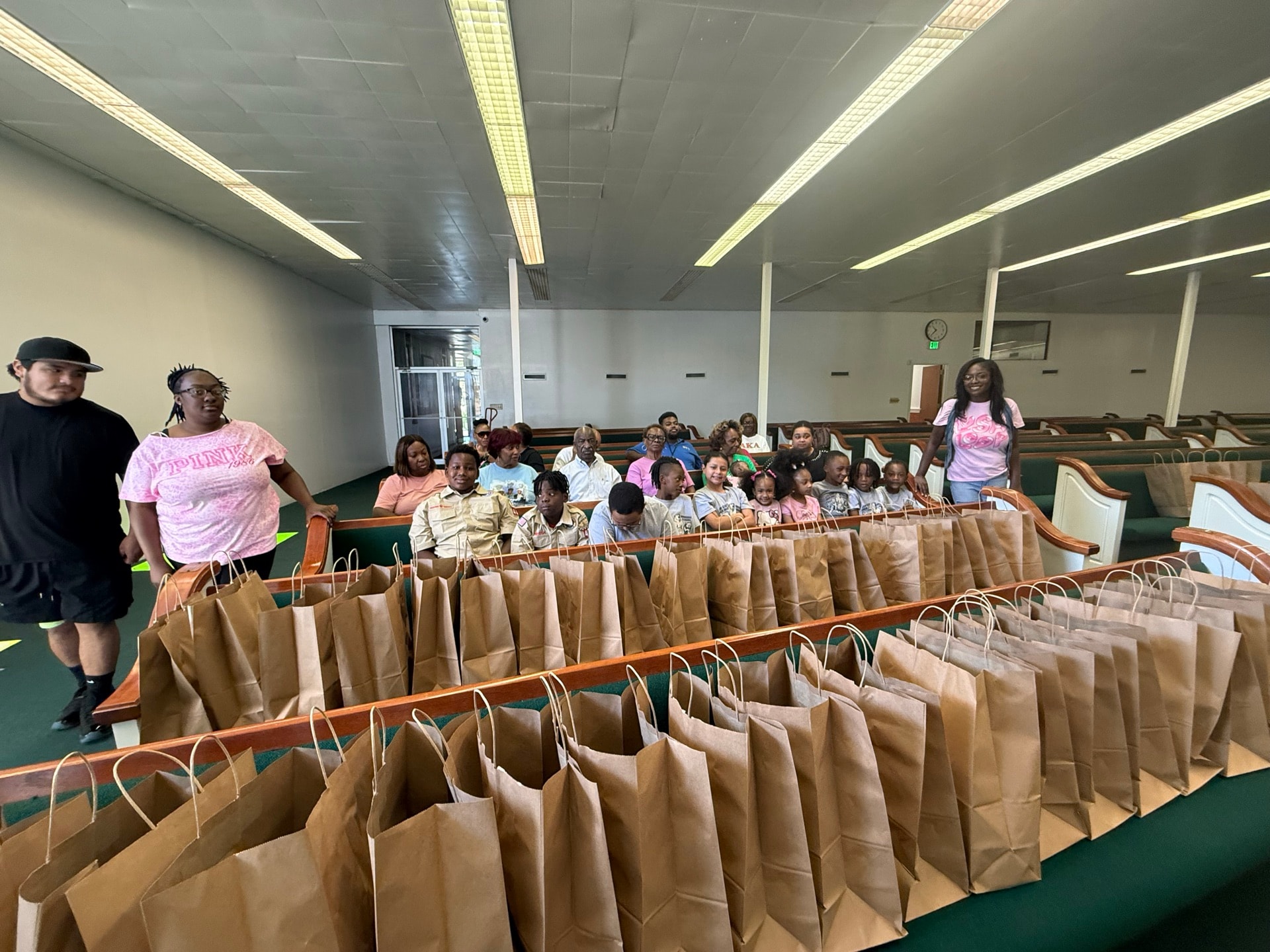 Community volunteers distributing food bags